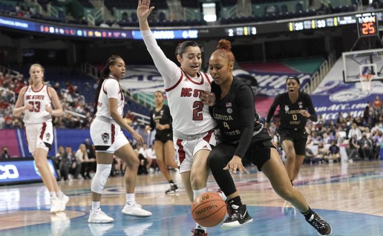 North Carolina State guard Raina Perez (2) defends against Florida State guard Sara Bejedi (4) during Friday's ACC tournament quarterfinal in Greensboro, N.C. (GERRY BROOME/Associated Press)