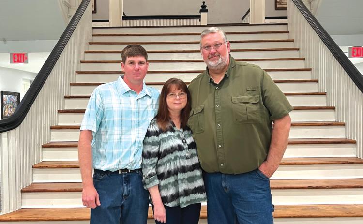 Thomas Henry (right) stands with his son, Josh, and wife, Zola, at his retirement party on Tuesday. Henry was recently hired by the City of High Springs as the Director of Public Works. (COURTESY)