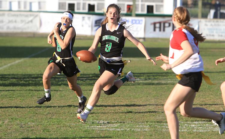 Suwannee quarterback Maci Campbell scrambles up the field against Bradford last season while Macy Bowers follows behind. (FILE)