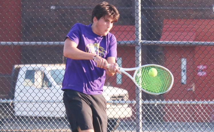 Columbia’s Aidan Boudreau returns a shot against Fleming Island’s Williams Hughes on Wednesday. (JORDAN KROEGER/Lake City Reporter)