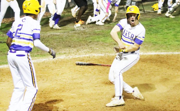 Columbia’s Hayden Gustavson celebrates after scoring the game-winning run against North Florida Christian on Friday night. (JORDAN KROEGER/Lake City Reporter)