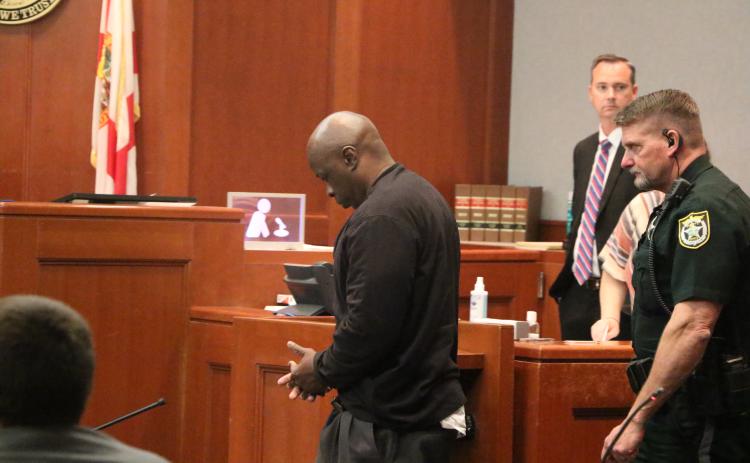 Richard P. Franklin (left) is escorted out of the Columbia County Courthouse Friday afternoon after a jury decided he wouldn’t face a death sentence for the 2012 murder of Columbia Correctional Institution officer Ruben Thomas. (MORGAN MCMULLEN/Lake City Reporter)