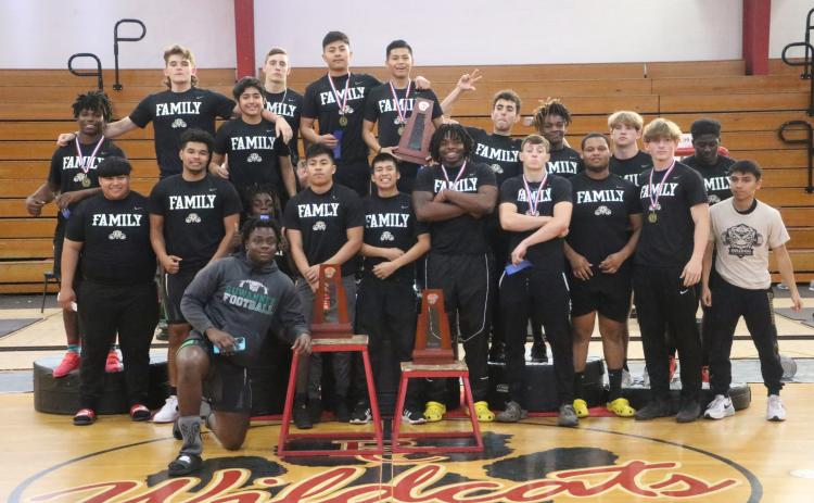 Suwannee's boys weightlifting team poses with the District 3-2A trophies after winning titles in the traditional and snatch on Thursday. (MORGAN MCMULLEN/Lake City Reporter)