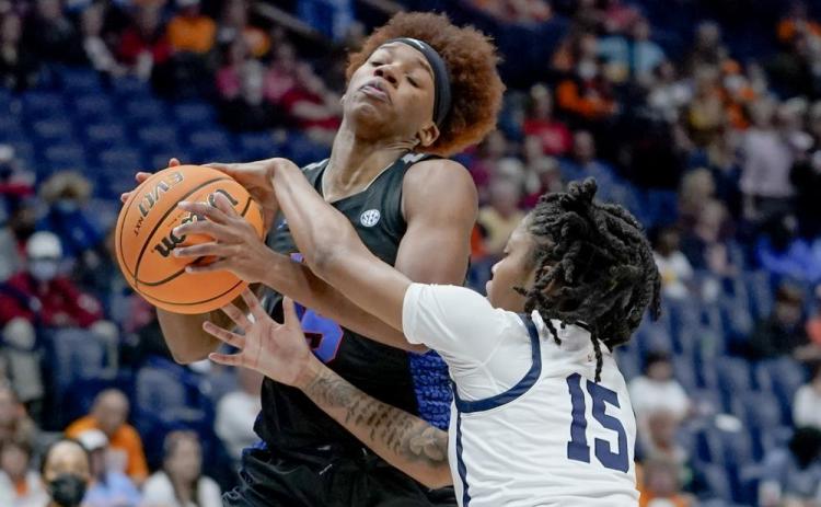 Florida's Nina Rickards, left, drives against Mississippi's Angel Baker (15)during Friday's game at Southeastern Conference tournament in Nashville, Tenn. (MARK HUMPHREY Humphrey)