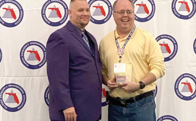 Shayne Morgan (right) was honored as the Florida Emergency Preparedness Association’s Chad Reed Emergency Management Professional of the Year in February. (COURTESY)