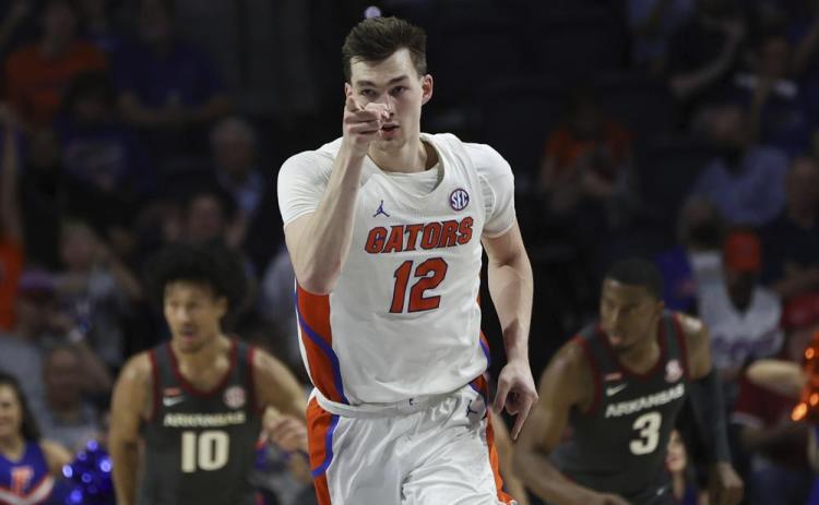 Florida forward Colin Castleton celebrates after making a shot against Arkansas on Feb. 22 in Gainesville. (MATT STAMEY/Associated Press)
