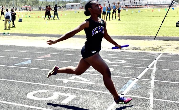 Columbia’s Stacy White crosses the finish line in the 4x100 relay at the Creekside Invitational on Saturday. (DYLAN ASPENWALL/Special to the Reporter)