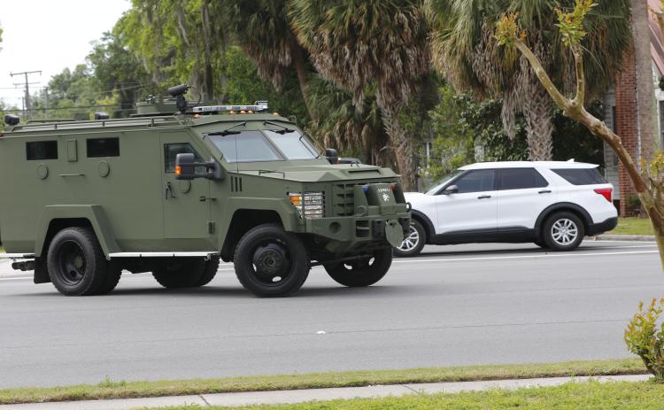 The Columbia County Sheriff’s Office SWAT vehicle pulls out on East Duval Street following a brief standoff Tuesday morning that ended peacefully. (JAMIE WACHTER/Lake City Reporter)