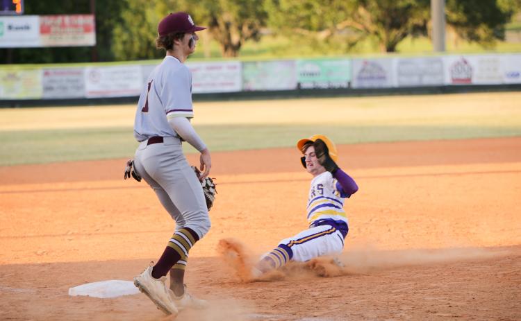 Columbia’s Matt Dumas slides safely into third base during Monday’s game against St. Augustine. (BRENT KUYKENDALL/Lake City Reporter_