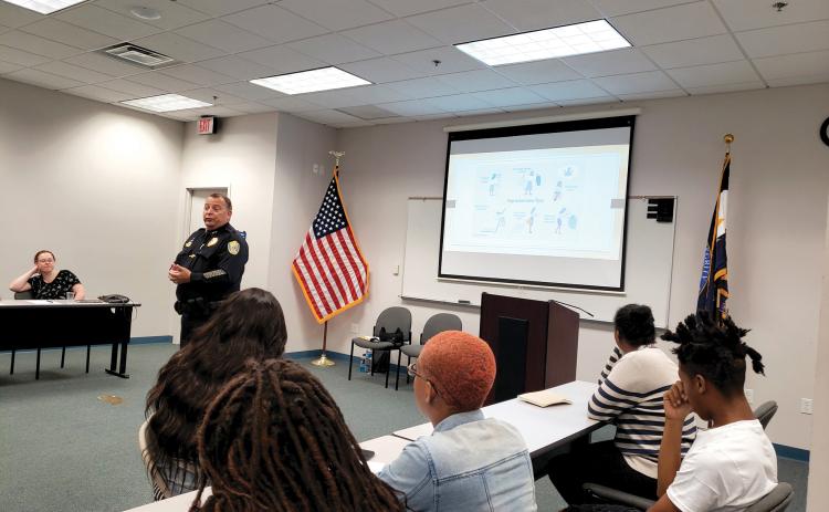 Lake City Police Chief Gerald Butler talks with teens about interviewing during the police department’s Sumer Youth Employment Program in 2019. (COURTESY)