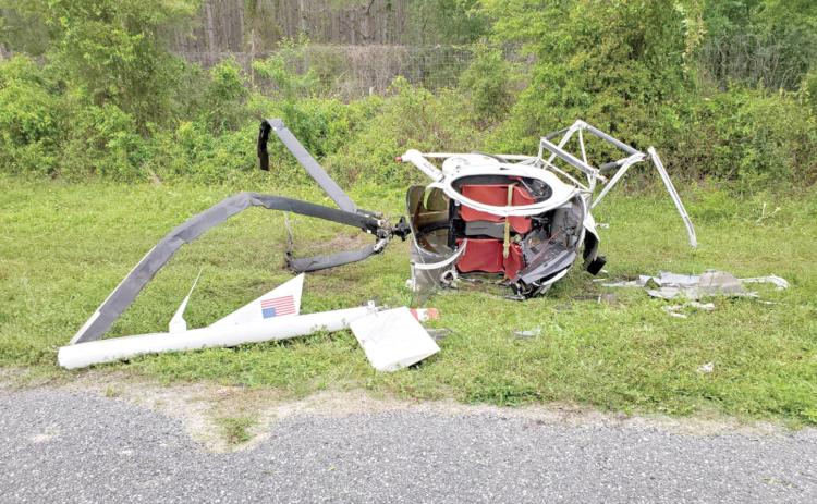 A helicopter crashed along State Road 47 on Saturday morning as it tried to escape dense fog. The pilot and passenger sustained just minor injuries. (COURTESY)