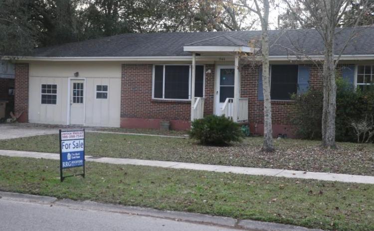 A ‘For Sale’ sign sits in a Lake City house’s front yard in December 2021. Columbia County’s housing market saw a 43.1% increase in closed sales in February 2022 compared to 2021’s numbers. (FILE)
