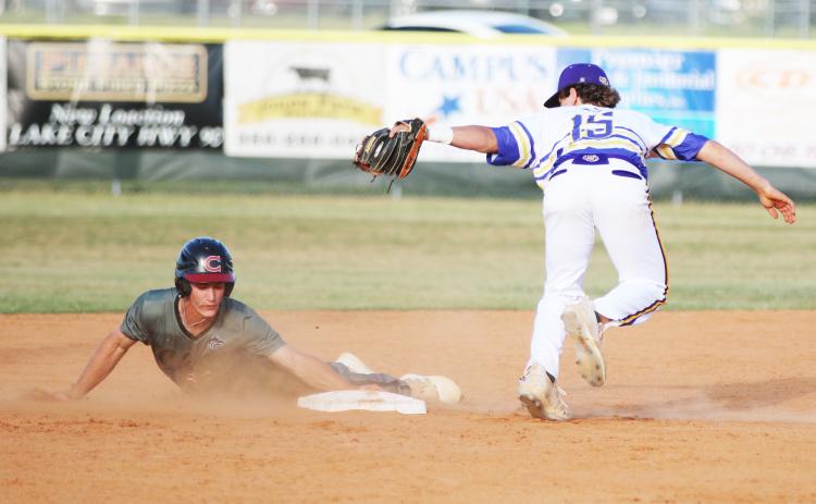 Columbia shortstop Truitt Todd misses the tag on Chiles shortstop Grant Gallagher as he steals second base on Wednesday. ( JORDAN KROEGER/Lake City Reporter)