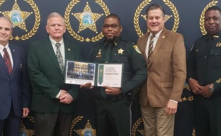 Columbia County Sheriff’s Office Lt. Martin Lee graduated from the Florida Sheriffs Institute Commanders Academy on Friday. Pictured with Lee (center) are Florida Sheriffs Association Director Steve Casey (from left), FSA President Sheriff Bobby McCallum of Levy County, Sheriff Mark Hunter and Sheriff Morris Young of Gadsden County. (COURTESY)