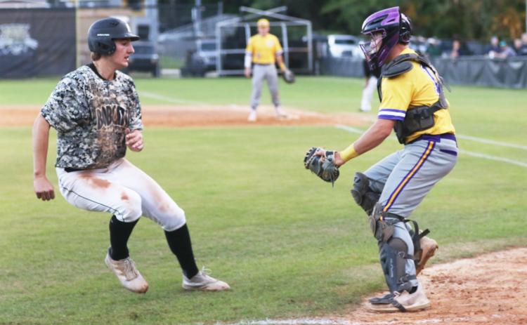 Columbia catcher Brent Howard tags out Buchholz runner JJ Gardner as he tries to score on Tuesday. (MORGAN MCMULLEN/Lake City Reporter)