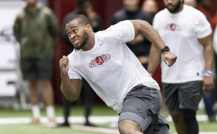 Evan Neal, participating in position drills at Alabama’s NFL Pro Day on March 30 in Tuscaloosa, Ala., is one of four players that Jacksonville is believed to be considering with the No. 1 pick in the NFL Draft, which begins Thursday. (AP File)