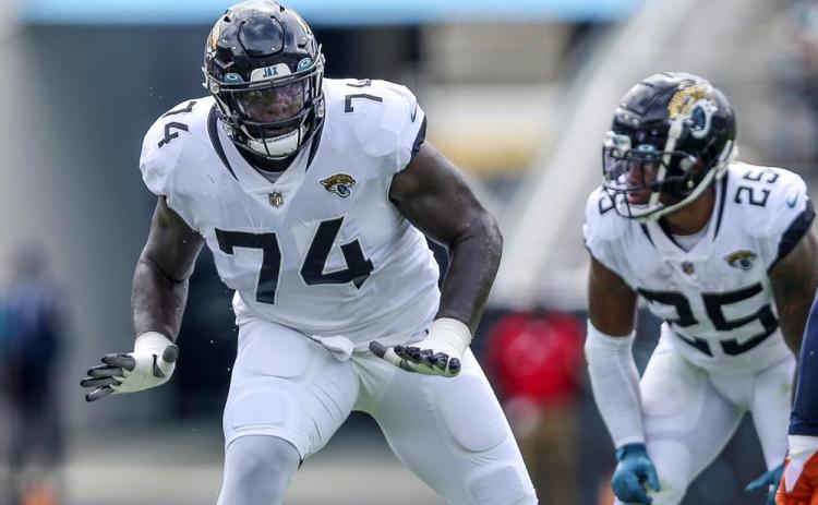 Jacksonville Jaguars offensive tackle Cam Robinson in action during a game against the Denver Broncos on Sept. 19, 2021, in Jacksonville. Robinson signed his franchise tender with the Jaguars on Wednesday, guaranteeing him $16.7 million this season. (AP File)