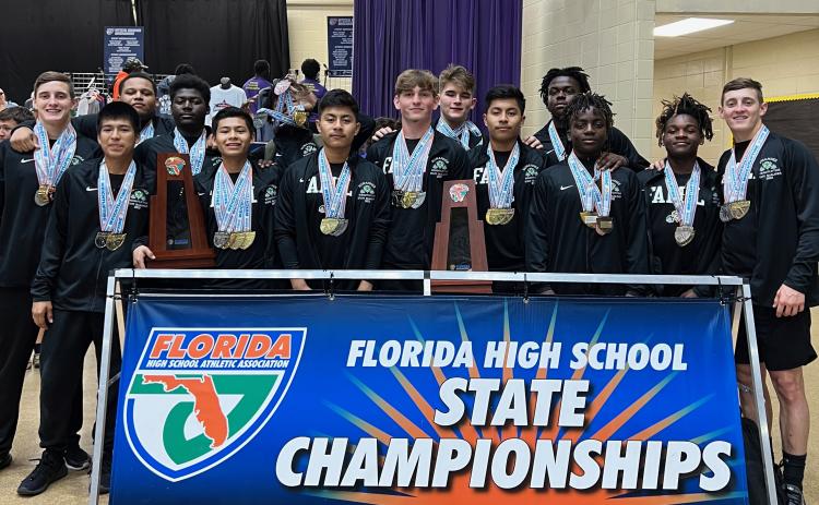 Suwannee lifters pose for a photo with their medals and state championship  trophies Friday afternoon at the Class 2A state championship meet. (COURTESY)