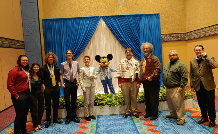 The Columbia High Academic Team placed second in the state last weekend at the competition at Walt Disney World. Team members are captain Jonathan Hunter (from left), Bianka Lorenzo, Ethan Cruz, Logan Mears, Allison Matsubara, Mickey Mouse, Xander Flegert, coach J.L. Kirby, assistant coach Scott Stefansen and Payton Young. Flegert was named to Team Florida as one of the top six players in the state. (COURTESY)