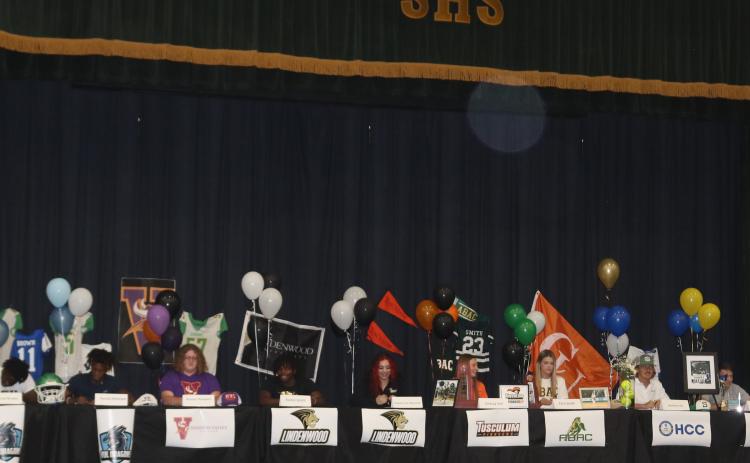 Twelve Suwannee seniors signed letters of intent during a ceremony Wednesday afternoon at the school. Signing were Jimariai Brooks (from left), Andrew Brown, Terrell Atkinson, Braxton Thompson, Austin Smith, Brooke-Lyn Hanuszak, Lindsay Self, Karis Smith, Matthew Gill, Peyton Slaughter, Tyson Musgrove and CJ Joyner. (JAMIE WACHTER/Lake City Reporter)