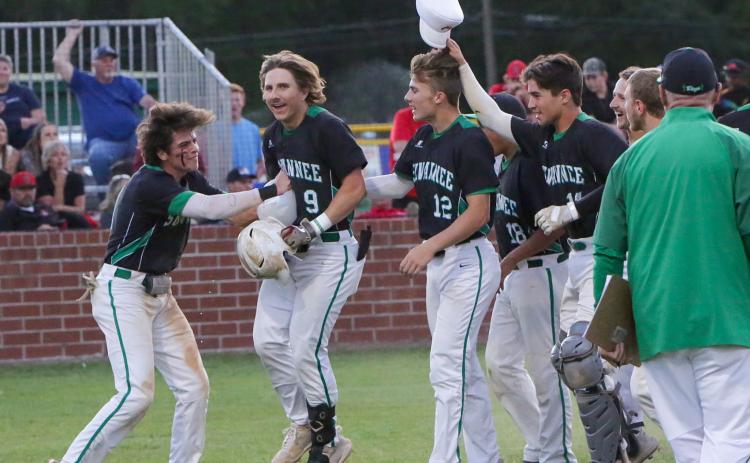Suwannee’s Tyson Greene is congratulated by his teammates after hitting a two-run home run against Baker County in the fourth inning Wednesday in the Region 1-4A quarterfinals at Booster Field. (BRENT KUYKENDALL/Lake City Reporter)