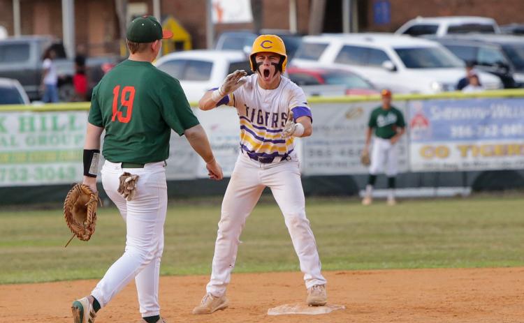 Columbia’s Truitt Todd celebrates on second base after hitting a two-RBI double against Mosley in the Region 1-5A semifinals on Thursday night. (BRENT KUYKENDALL/Lake City Reporter)