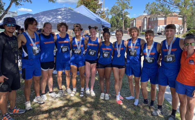 Branford’s track team brought home 11 medals from the Class 1A state meet on Wednesday in Gainesville. Team members pictured are coach Tim Clark (from left), Justin Hernandez, Ann Marie Mowrer, Austin Malaguti, Josue Sierra Berrios, Hannah Terry, Zamaria Granado, Nathalia Veal, Seth Humphries, Adrik Miller, Kyson Johnson and coach Erin Clark. Not pictured are Devin Mosley and Zoe Richmond. (COURTESY)