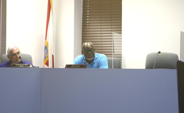 Councilman Jake Hill Jr. (right) speaks during a meeting in late April as Mayor Stephen Witt listens. (FILE)