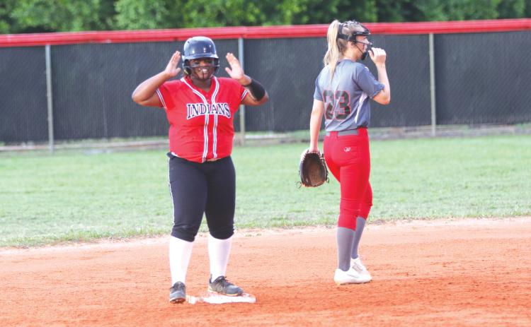 Fort White’s N’Coreyia Atkins celebrates after an RBI double against Lafayette during the Region 3-1A semifinals on Thursday night. (MORGAN MCMULLEN/Lake City Reporter)