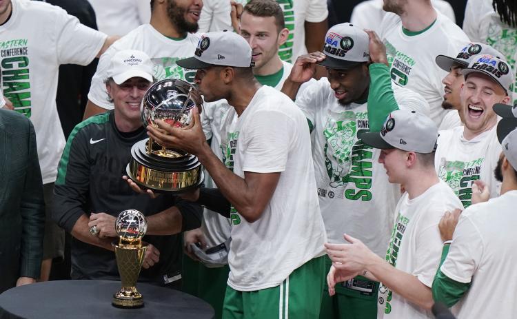 Boston Celtics center Al Horford kisses the NBA Eastern Conference trophy after defeating the Miami Heat in Game 7 of the Eastern Conference finals on Sunday in Miami. (WILFREDO LEE/Associated Press)