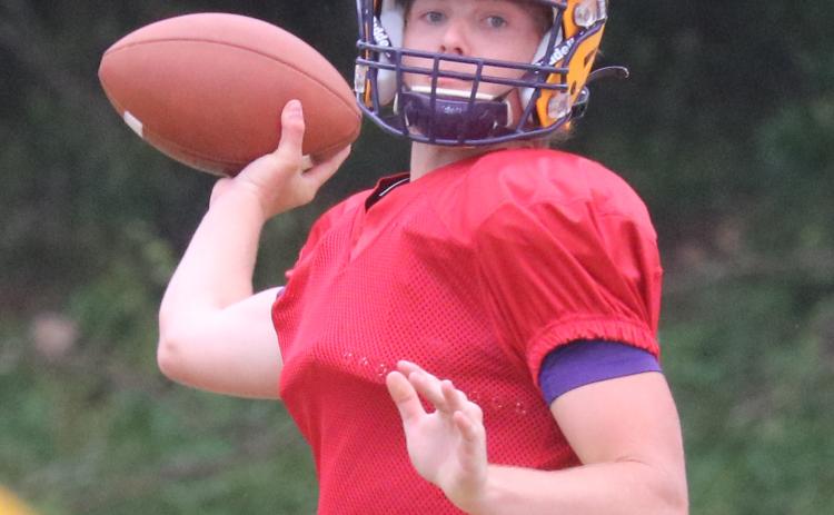 Columbia quarterback Evan Umstead throws a pass during Friday’s practice. (JORDAN KROEGER/Lake City Reporter)