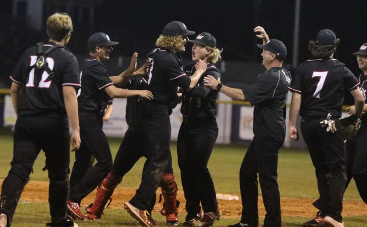 Fort White players celebrate after defeating Union County in the Region 3-1A semifinals on Tuesday. (MORGAN MCMULLEN/Lake City Reporter)