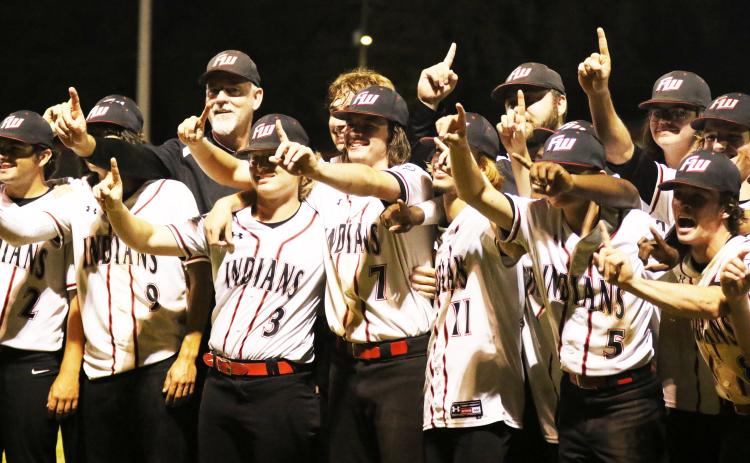 Fort White’s baseball team celebrates after defeating Lafayette 3-2 to win the Region 3-1A title on Friday night. (MORGAN MCMULLEN/Lake City Reporter)