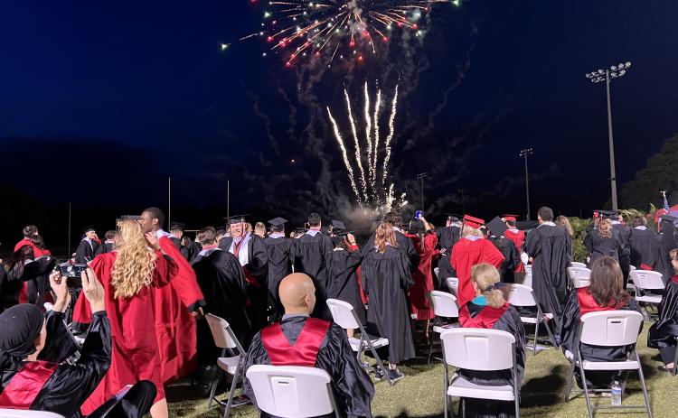 Fort White graduates watch a fireworks display at the end of commencement exercises Friday night at Arrowhead Stadium. (RAY CARPENTER/Special to the Reporter)
