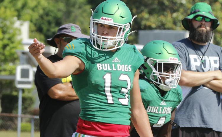 Suwannee quarterback Bronsen Tillotson signals to a teammate during Wednesday’s practice. (JAMIE WACHTER/Lake City Reporter)