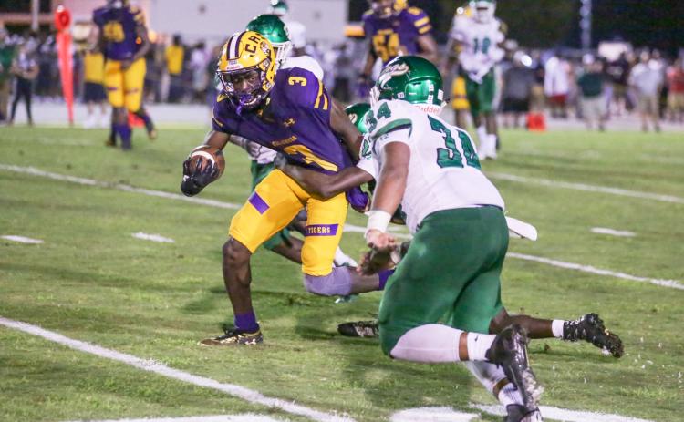 Columbia receiver TJ Jones tries to escape a tackle against Suwannee on Aug. 31, 2018. (BRENT KUYKENDALL/Lake City Reporter)