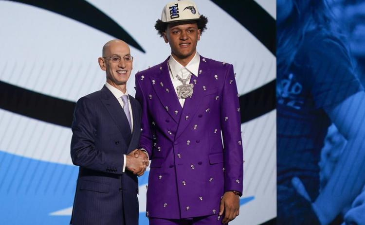 Paolo Banchero, right, poses for a photo with NBA Commissioner Adam Silver after being selected as the number one pick overall by the Orlando Magic in the NBA draft on Thursday in New York. (JOHN MINCHILLO/Associated Press)