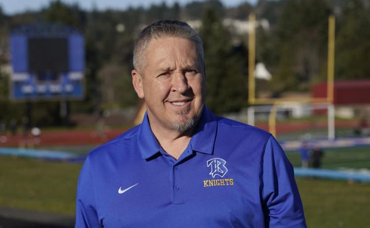 Joe Kennedy, a former assistant football coach at Bremerton High School in Bremerton, Wash., poses for a photo March 9, 2022, at the school's football field. (TED S. WARREN/AP File)