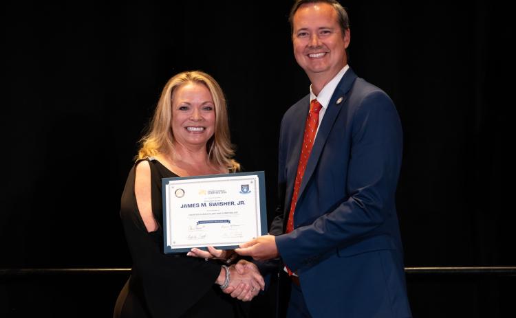 Citrus County Clerk Angela Vick presents Clerk Jay Swisher with his certification as a Florida Clerk and Comptroller. (COURTESY)