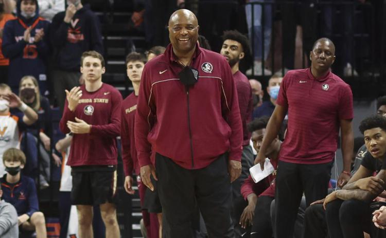Florida State head coach Leonard Hamilton smiles from the bench during a a game against Virginia on Feb. 26 in Charlottesville, Va. (AP FILE)