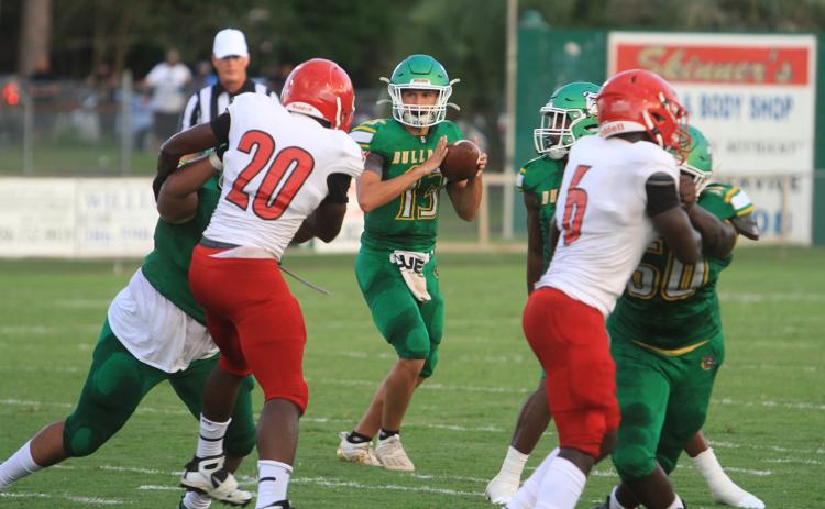 Suwannee quarterback Bronsen Tillotson drops back to pass against Hamilton County in the Preseason Classic on Aug. 20, 2021. The teams will face each other in the regular season this year on Sept. 2 in Jasper. (FILE)