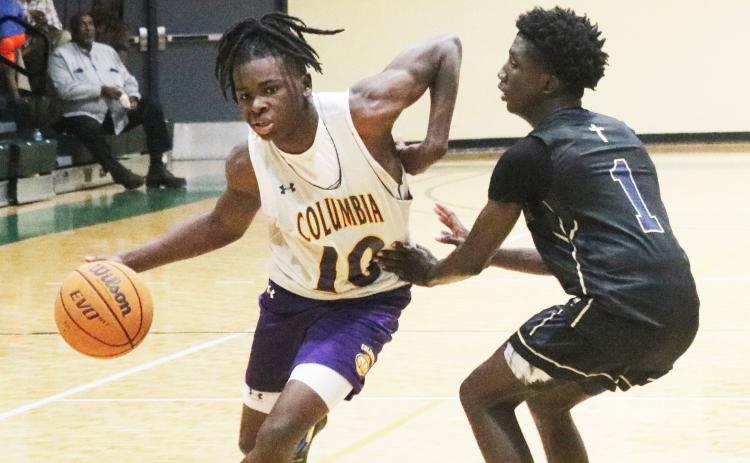 Columbia guard Isaac Broxey drives to the basket against St. John Paul II during the team’s shot clock league on June 8 at FGC. (JORDAN KROEGER/Lake City Reporter)