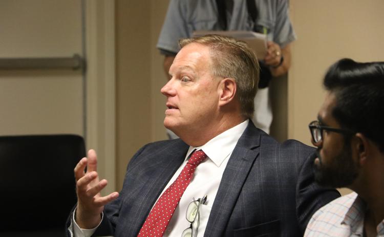 Meridian Behavioral Healthcare Inc. CEO Don Savoie expands on an idea during the Lake Shore Hospital Authority’s Monday meeting. (MORGAN MCMULLEN/Lake City Reporter)