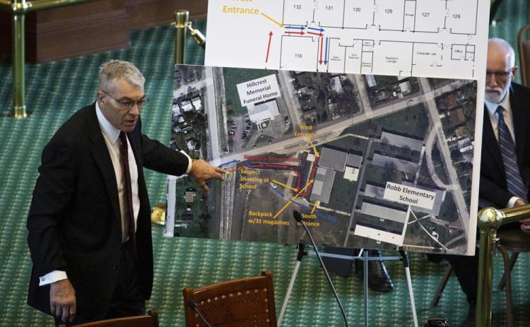 Texas Department of Public Safety Director Steve McCraw uses maps and graphics to present a timeline of the school shooting at Robb Elementary School in Uvalde, during a hearing Tuesday in Austin, Texas. Two teachers and 19 students were killed. (SARA DIGGINS/Austin American-Statesman via AP)