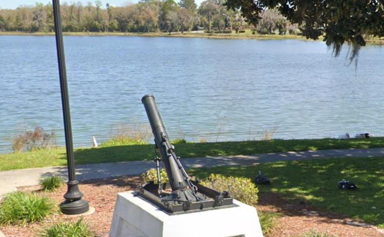 A World War I trench mortar sits on the banks of Lake DeSoto as a memorial to all who fought in the war. (COURTESY)