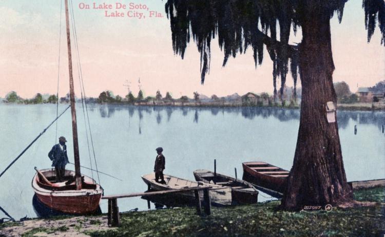 An undated painting of the banks of Lake DeSoto shows a quiet life enjoyed by Columbia County pioneers, even on Independence Day. (COURTESY)