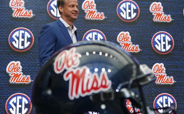 Mississippi head coach Lane Kiffin walks to the podium before speaking during SEC Media Days on Monday in Atlanta. (JOHN BAZEMORE/Associated Press)
