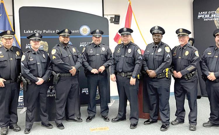 Lake City Police Chief Gerald Butler (left) promoted five officers in a ceremony Tuesday. Those promoted include (from left) Cpl. Gary Borchardt, Sgt. Michael Del Castillo, Cpl. Tim Parisi, Cpl. Brandon Rose and Cpl. LaQuinta Lovick-Plemmons. Also pictured are Assistant Chief Andy Miles (Second from right) and Lt. Garrett Register (right). (COURTESY)