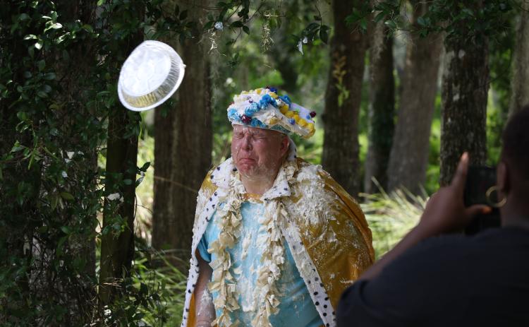 Lifestyle Enrichment Center Executive Director David Huckabee braces for impact as a whipped cream pie flies at him during Columbia County Senior Services’ 50th anniversary celebration on Thursday. (MORGAN MCMULLEN/Lake City Reporter)