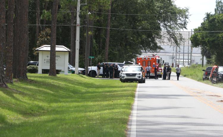 Law enforcement and first responders gathered on the Florida Gateway College campus Thursday when a bomb threat was called in against buildings on the college for the second straight day. (STAFF)
